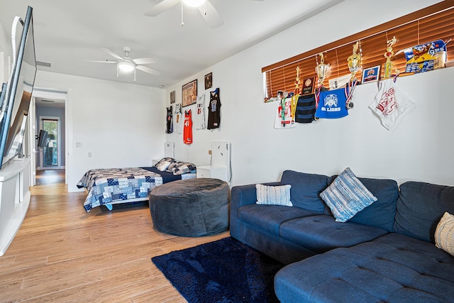 11951 Torreyanna Cir, Palm Beach Gardens, FL 33412 - living area featuring light wood-style flooring and a ceiling fan