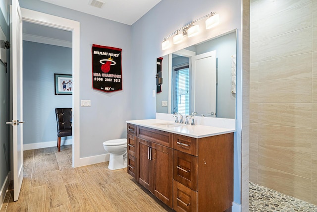 11951 Torreyanna Cir, Palm Beach Gardens, FL 33412 - bathroom with visible vents, baseboards, toilet, wood finished floors, and vanity