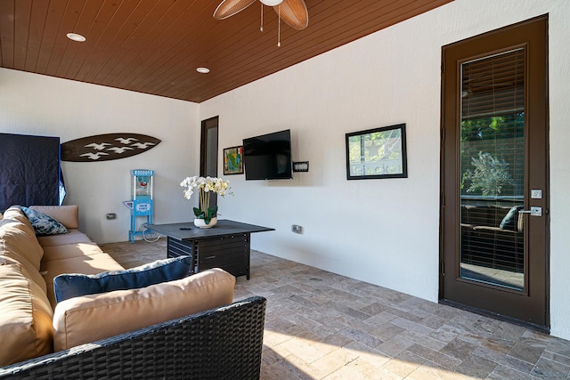 11951 Torreyanna Cir, Palm Beach Gardens, FL 33412 - living room featuring wooden ceiling, stone finish flooring, and ceiling fan
