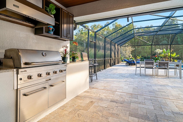 11951 Torreyanna Cir, Palm Beach Gardens, FL 33412 - view of patio / terrace with glass enclosure, grilling area, and an outdoor kitchen