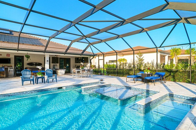 11951 Torreyanna Cir, Palm Beach Gardens, FL 33412 - pool featuring a patio, outdoor dining area, a lanai, and a hot tub
