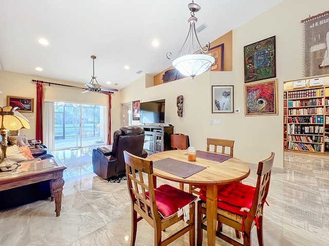 dining space with vaulted ceiling