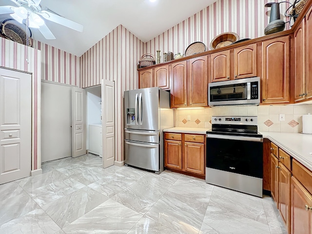 kitchen featuring appliances with stainless steel finishes and ceiling fan