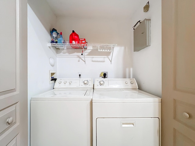 washroom featuring washer and clothes dryer