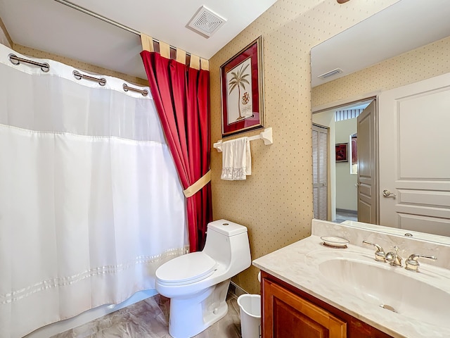 bathroom featuring vanity, toilet, and a shower with shower curtain