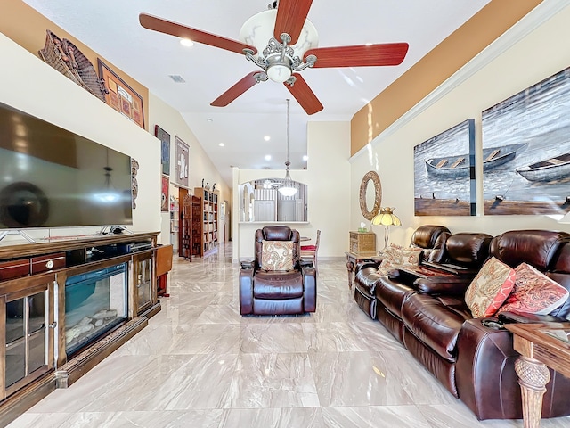 living room featuring ceiling fan and vaulted ceiling