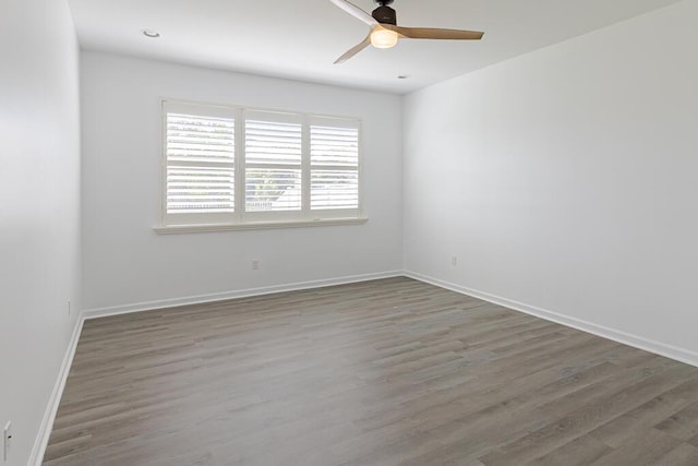 unfurnished room featuring hardwood / wood-style flooring and ceiling fan