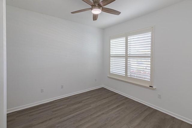 unfurnished room with dark hardwood / wood-style floors and ceiling fan