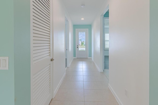 hallway with light tile patterned floors