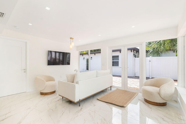 living room with french doors, marble finish floor, visible vents, and recessed lighting