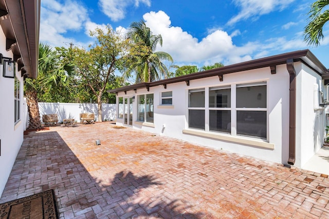 view of patio / terrace featuring fence