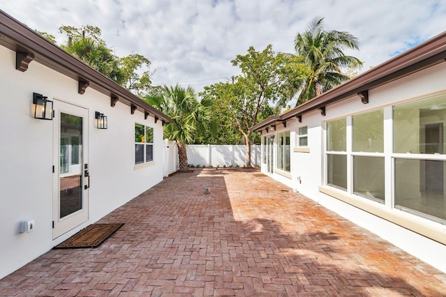 view of patio featuring fence