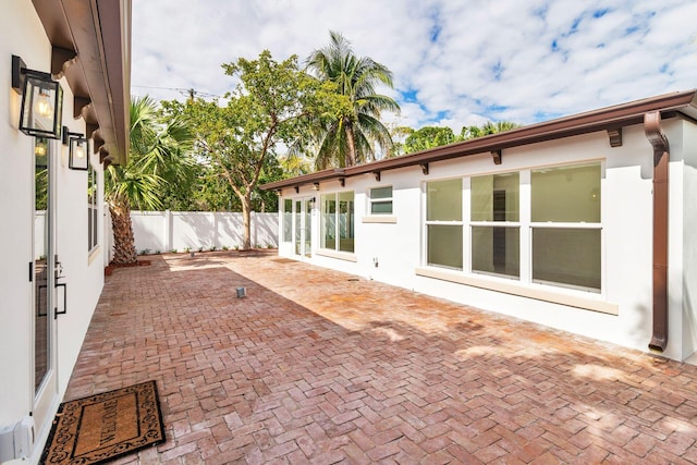 view of patio featuring fence
