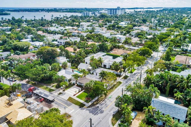 birds eye view of property with a water view and a residential view