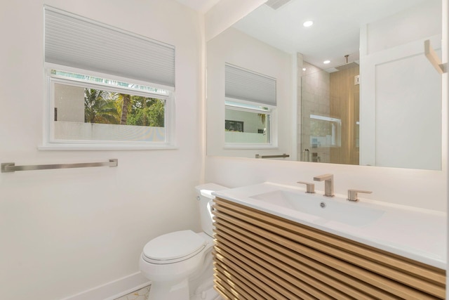 full bath featuring baseboards, toilet, recessed lighting, vanity, and a stall shower
