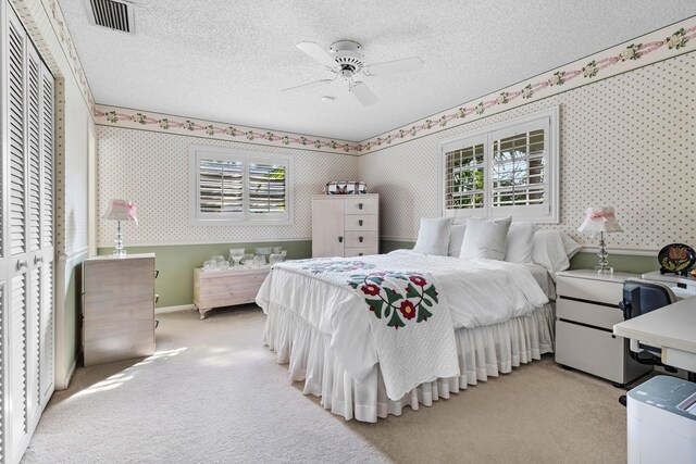 1210 Dolphin Rd, Singer Island, FL 33404 - carpeted bedroom featuring wallpapered walls, a ceiling fan, and baseboards