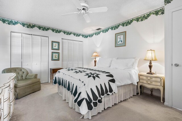 1210 Dolphin Rd, Singer Island, FL 33404 - bedroom featuring baseboards, a ceiling fan, dark colored carpet, and multiple closets