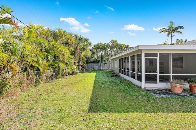 view of yard featuring a sunroom