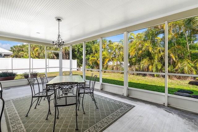 1210 Dolphin Rd, Singer Island, FL 33404 - sunroom / solarium featuring french doors, a chandelier, and outdoor dining space