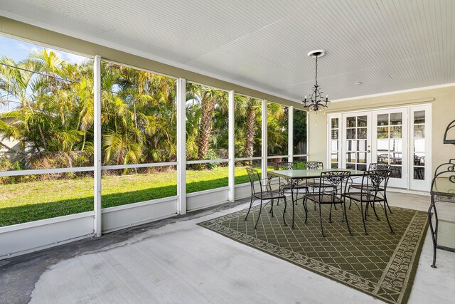 1210 Dolphin Rd, Singer Island, FL 33404 - rear view of house featuring stucco siding, a sunroom, fence, and a lawn
