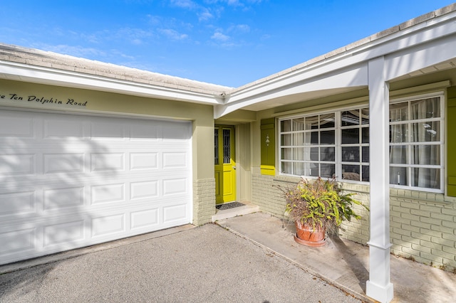 property entrance with a garage