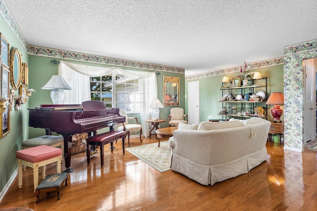 living room with hardwood / wood-style flooring and a textured ceiling