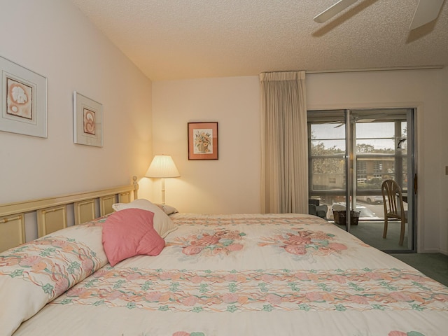 bedroom with dark colored carpet, access to outside, ceiling fan, and a textured ceiling