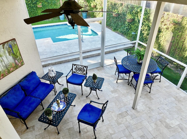 sunroom / solarium with ceiling fan