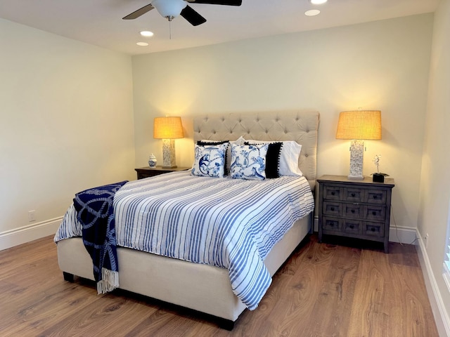 bedroom with ceiling fan and hardwood / wood-style floors