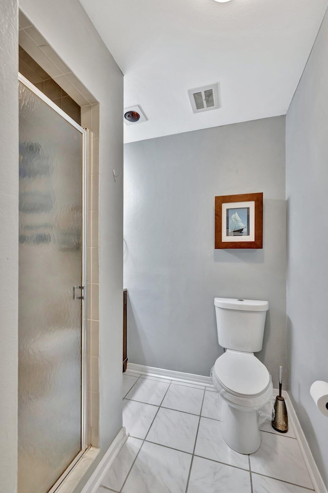 bathroom with walk in shower and toilet