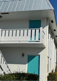 view of property exterior with a balcony