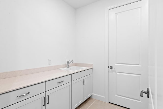 bathroom featuring tile patterned flooring and vanity