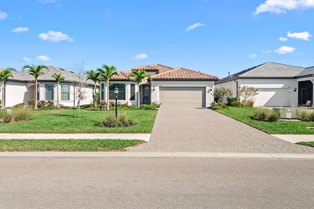 view of front facade with a garage and a front yard