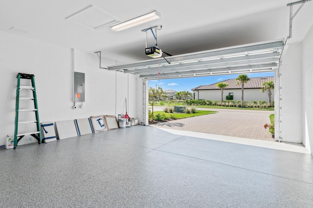 garage featuring a garage door opener and electric panel