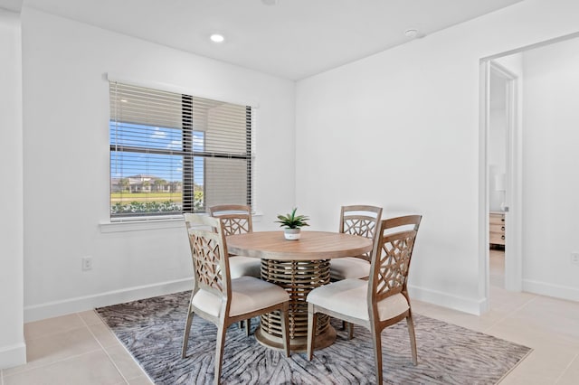 dining area featuring light tile patterned floors