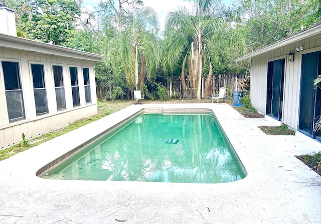 view of swimming pool featuring a fenced in pool and a fenced backyard