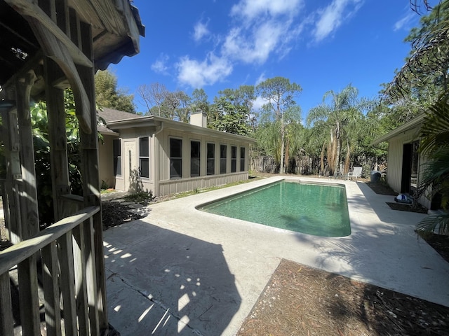 outdoor pool featuring a patio