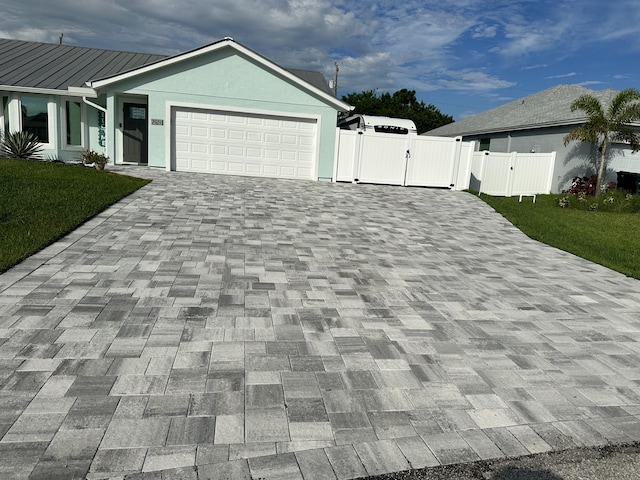 exterior space featuring a garage and a front lawn