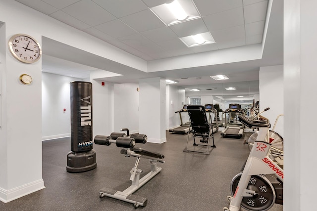 workout area featuring a paneled ceiling