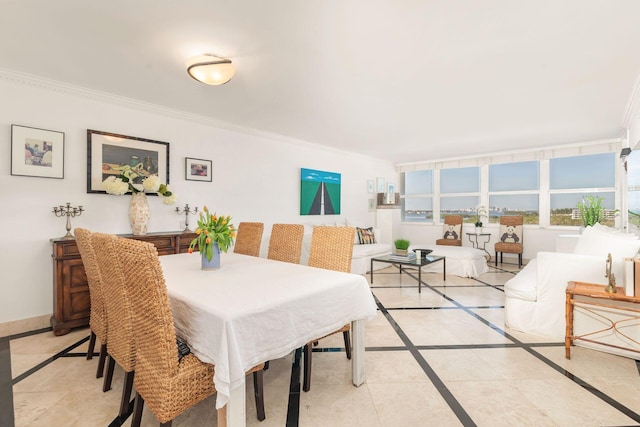 dining room featuring ornamental molding