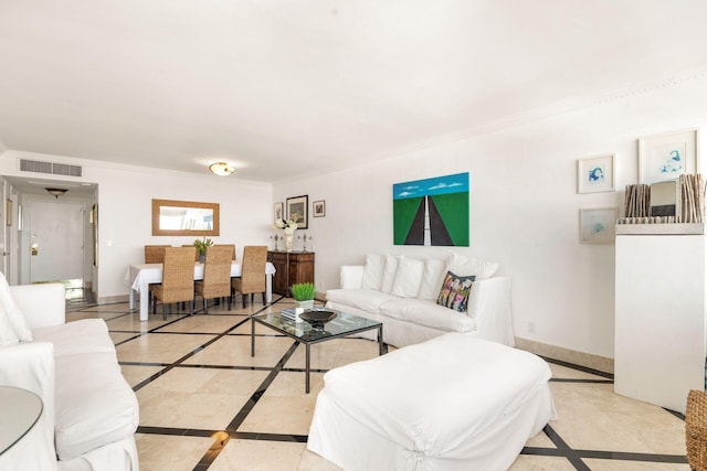 living room with ornamental molding