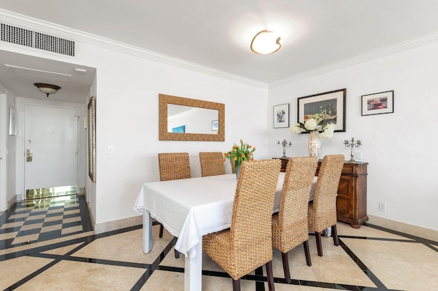 dining room featuring ornamental molding