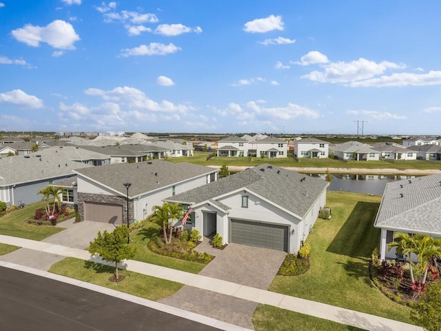 aerial view with a water view and a residential view