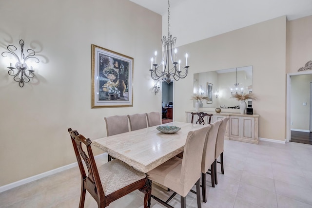 tiled dining area with a chandelier and high vaulted ceiling