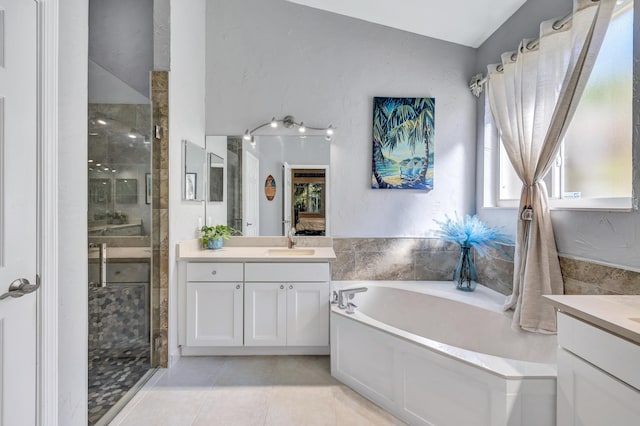 bathroom featuring vanity, tile patterned floors, and plus walk in shower