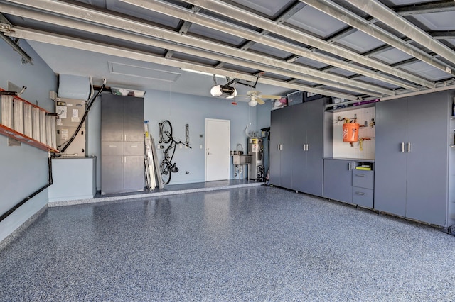 garage featuring a garage door opener and water heater