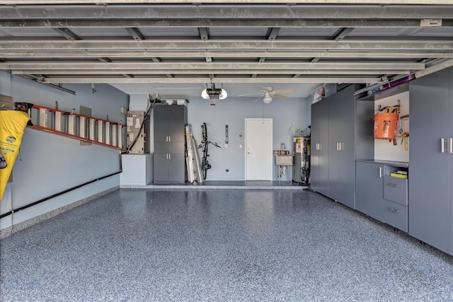 garage with a garage door opener, electric water heater, and heating unit