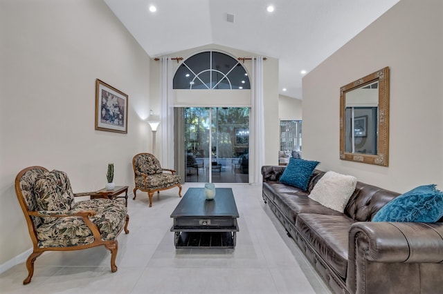 living room with high vaulted ceiling