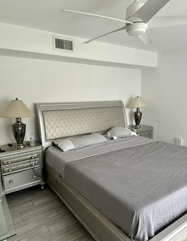 bedroom featuring hardwood / wood-style flooring and ceiling fan