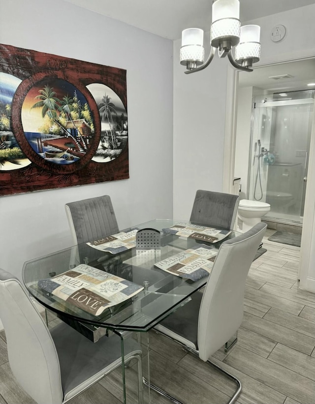 dining space featuring a chandelier